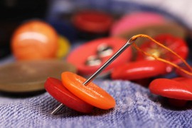 How to Sew a Button on Pants